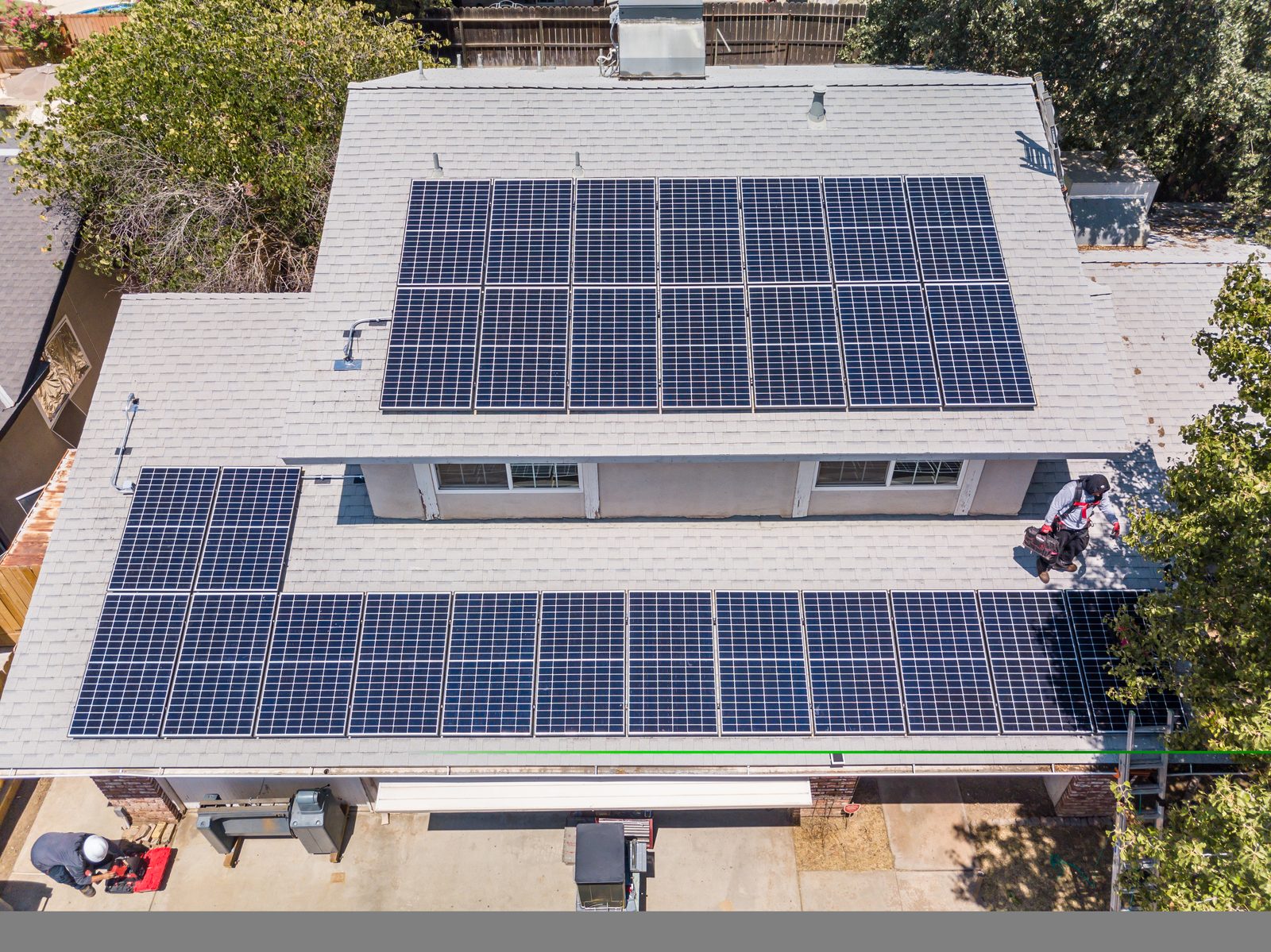 Drone shot of a residential solar array installed by Net Metering Systems in the Central Valley